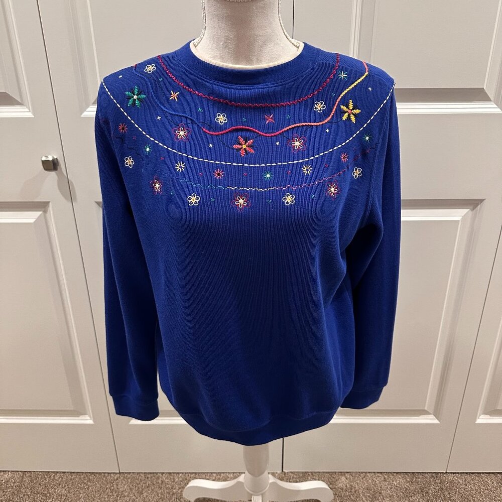 Royal blue Koret Sweater embroidered with flowers and other designs size medium